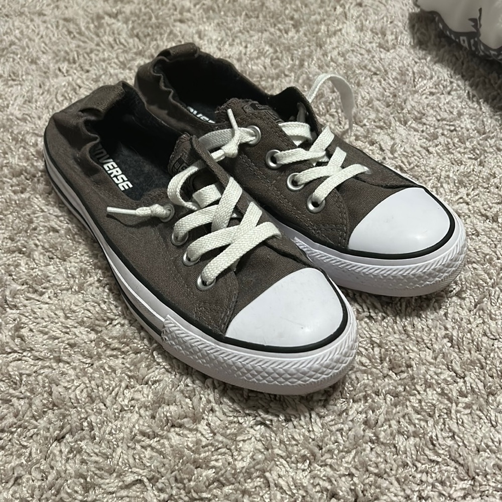 Low-top Converse in a grey-brown shade, women’s size 7.5